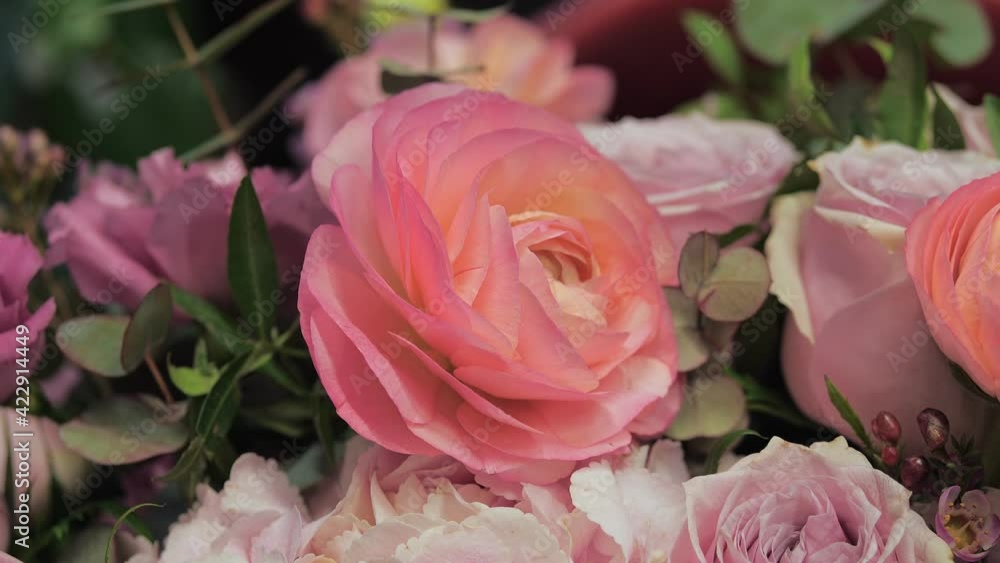 Close-up of bridal bouquet with pink roses in a flower shop. Fresh cut flowers. Close-up of bridal bouquet with pink roses in a flower shop. Fresh cut flowers.