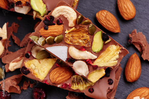Handmade milk chocolate with dried fruits and nuts