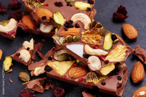 Handmade milk chocolate with dried fruits and nuts