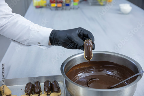 Making chef eclairs in the kitchen. Eclairs Pasta Turkish delicious adds to the platter pasta. photo