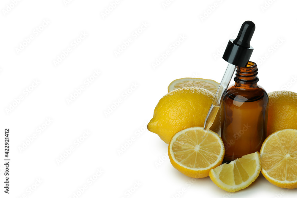 Dropper bottle with oil and lemons isolated on white background Dropper bottle with oil and lemons isolated on white background