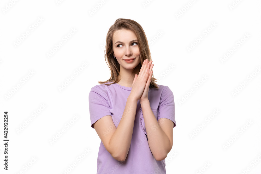 Portrait of young woman with dreamy cheerful expression, thinking Portrait of young woman with dreamy cheerful expression, thinking