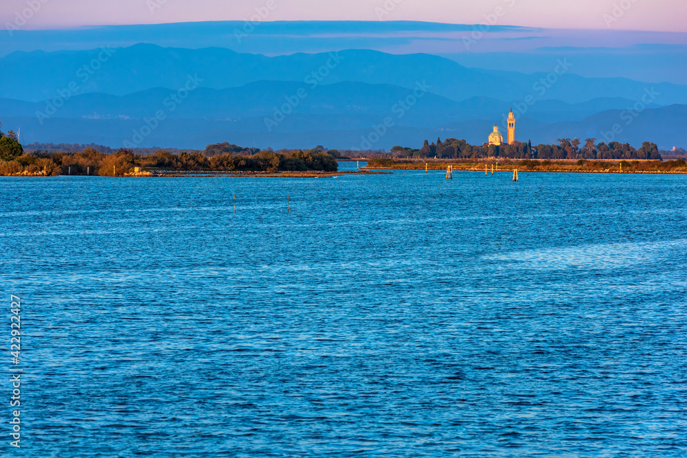 Grado and its lagoon at sunset. Glimpses of tranquility.