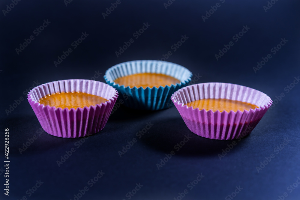 Homemade recipe to cook some carrot muffins at home. Three units piled into the mold before baking Homemade recipe to cook some carrot muffins at home. Three units piled into the mold before baking