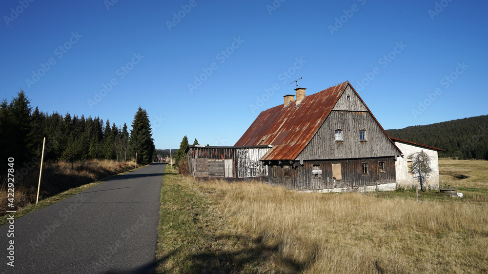 Jizerka historic village with traditional wooden huts in pure mountain nature, popular tourist destination, Jizera Mountains, Czech Republic Jizerka historic village with traditional wooden huts in pure mountain nature, popular tourist destination, Jizera Mountains, Czech Republic