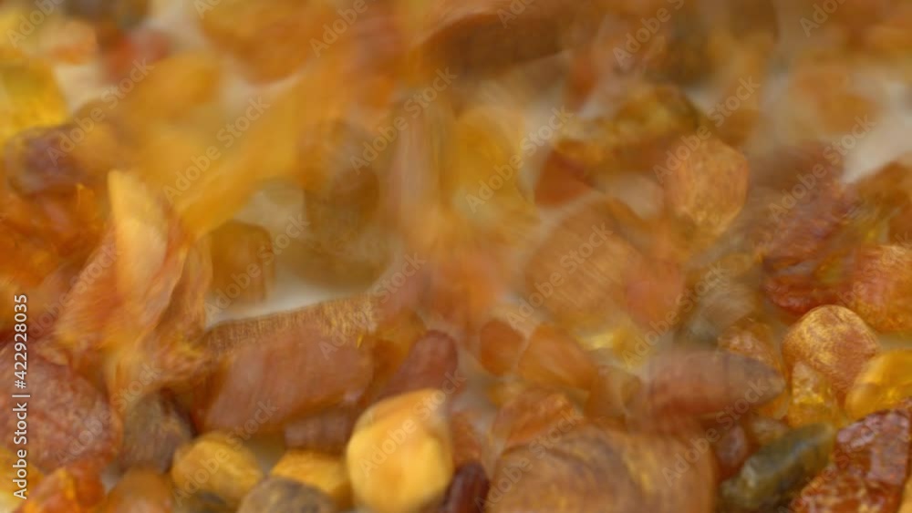 Raw Amber Stones Falling Down Slow Motion Close-up Raw Amber Stones Falling Down Slow Motion Close-up