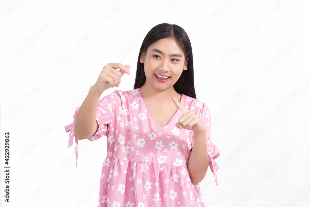 Asian woman in pink dress shows her hand to present or hold something on white background.