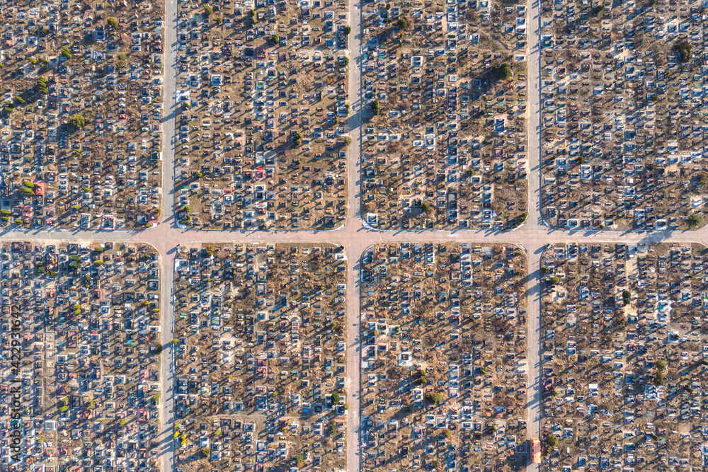 Aerial view of huge urban cemetery with grid layout. Increase in the scale of the cemetery due to the excessive number of deaths by Covid-19 pandemic Aerial view of huge urban cemetery with grid layout. Increase in the scale of the cemetery due to the excessive number of deaths by Covid-19 pandemic