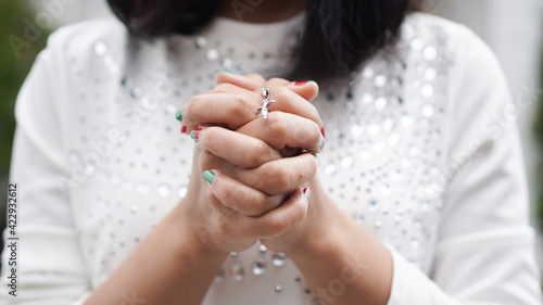 a Christian woman praying humbly in church photo