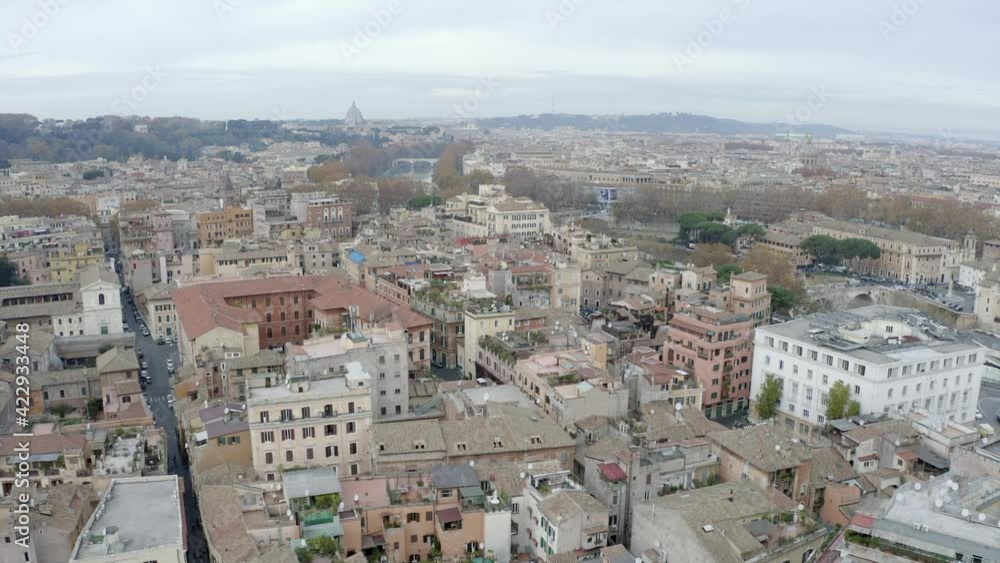 Aerial view of Trastevere, characteristic old district in downtown Rome, Italy. Roman city center seen from drone flying in sky. Italian panoramic urban landscape in Roma Aerial view of Trastevere, characteristic old district in downtown Rome, Italy. Roman city center seen from drone flying in sky. Italian panoramic urban landscape in Roma