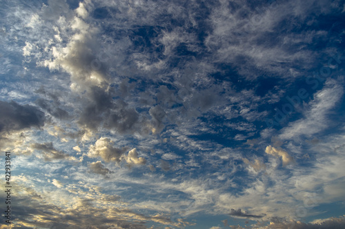 Cumulus clouds in a blue sky.