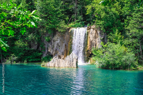 Beautiful waterfalls in the green  azure lake water  natural nature beauty paradise  nature background  postcard and wallpaper  good for spa and massage interior 