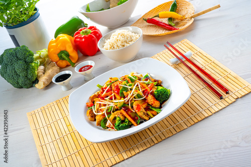 sweet and sour chicken with rice and vegetables photo