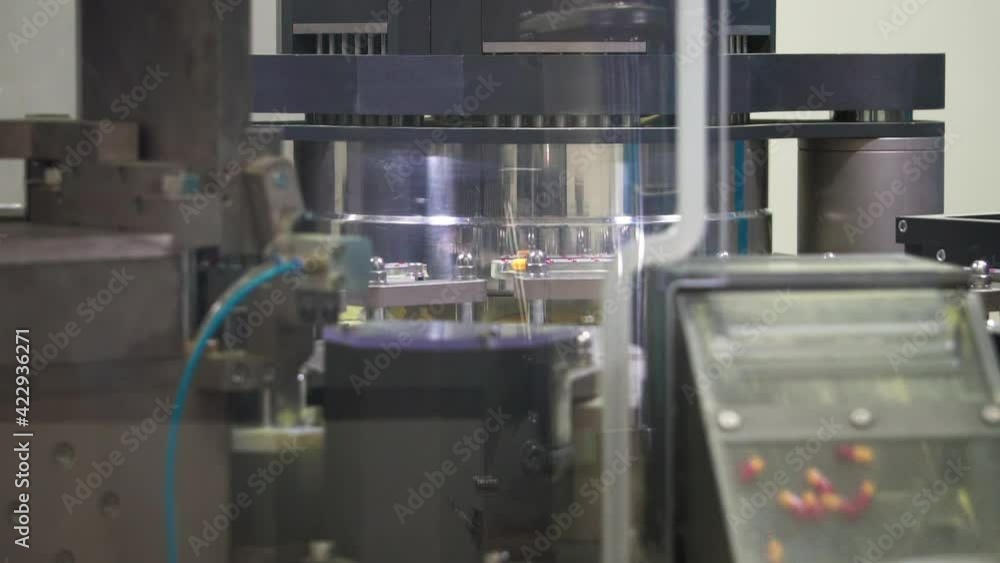 Medical encapsulation machine. Capsules are sent to different ...