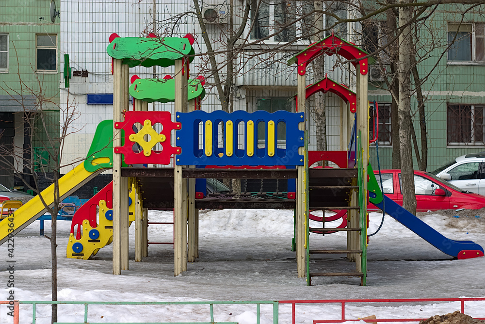 colorful slides on the children's playground near the house