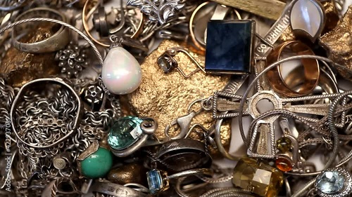 Pile of silver and gold jewelry with jewels rotating 4K