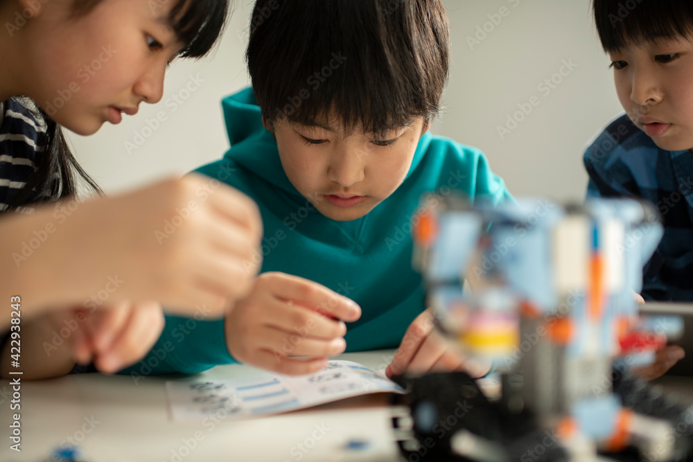 Elementary School Students Assembling Programming Robot Stock Photo ...