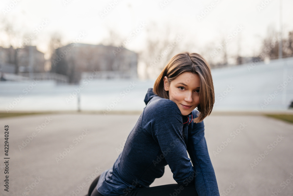 Portrait of cheerful woman posing for camera.