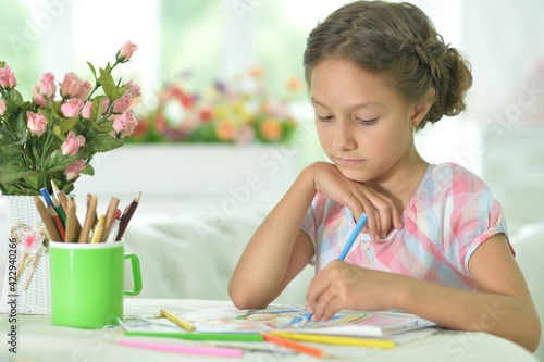  cute girl drawing picture at home