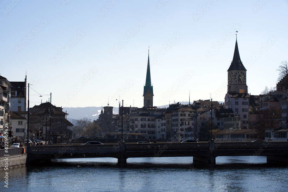 Old town of Zurich with churches Fraumünster (German), translation is Women's Minster, and St. Peter. Photo taken October 24th, 2020, Zurich, Switzerland. Old town of Zurich with churches Fraumünster (German), translation is Women's Minster, and St. Peter. Photo taken October 24th, 2020, Zurich, Switzerland.