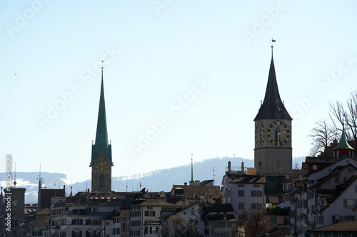 Old town of Zurich with churches Fraumünster (German), translation is Women's Minster, and St. Peter. Photo taken October 24th, 2020, Zurich, Switzerland.
