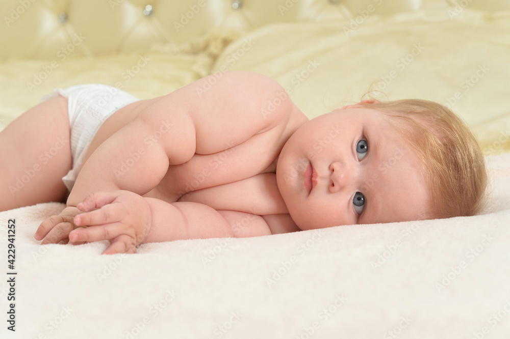 cute little baby girl on bed lying cute little baby girl on bed lying
