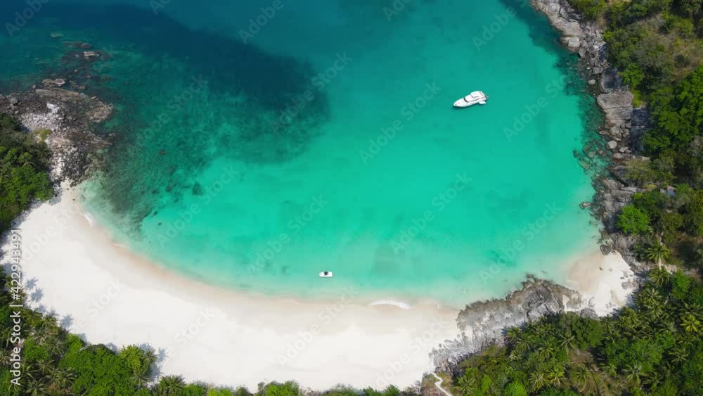 4K. 29.97 FPS. Aerial view shot. Drone camera over white beach sand and sew water clear. Nature video view of beautiful tropical beach and sea in sunny day. Palm tree at beach. At Phuket, Thailand. 4K. 29.97 FPS. Aerial view shot. Drone camera over white beach sand and sew water clear. Nature video view of beautiful tropical beach and sea in sunny day. Palm tree at beach. At Phuket, Thailand.