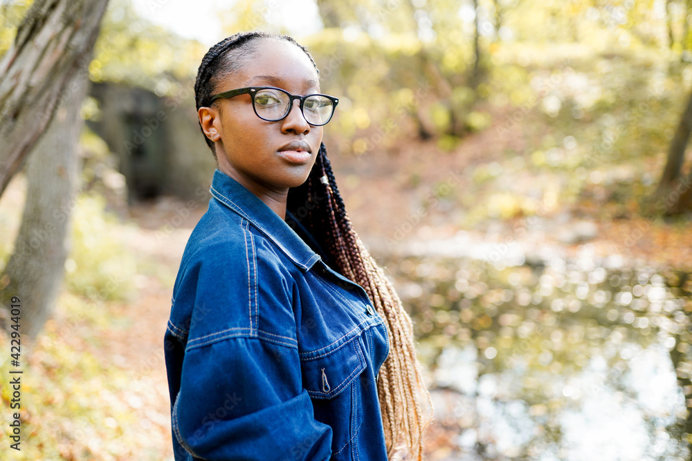 Close up portrait of a beautiful young african american woman outdoors Close up portrait of a beautiful young african american woman outdoors