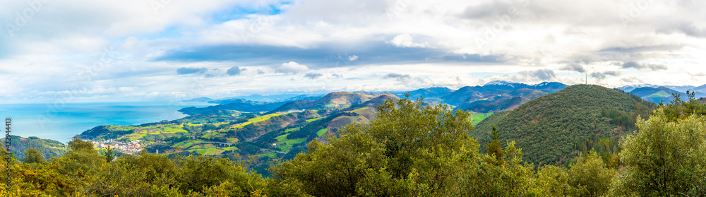 Panoramic view of the town and the sea from Mount Arno in the municipality of Mutriku in Gipuzkoa. Basque Country, Spain Panoramic view of the town and the sea from Mount Arno in the municipality of Mutriku in Gipuzkoa. Basque Country, Spain