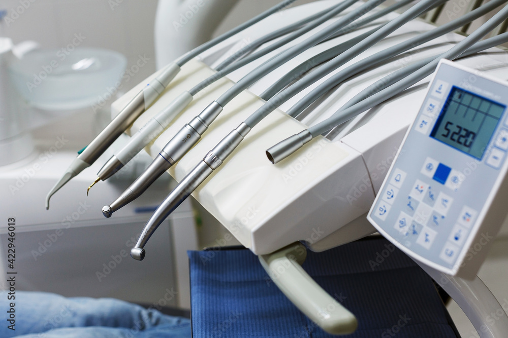 dental equipment with instruments and handpieces for patient treatment in the clinic