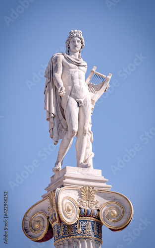 Apollo white marble statue and blue sky, Athens Greece