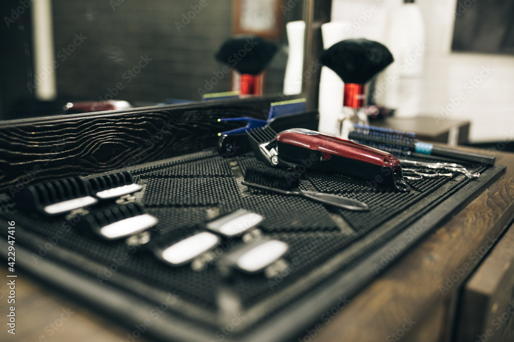 Professional tools for haircut in barber shop. Barber shaving accessories. Barber shave razor. The hairdresser's tools are laid flat on the table