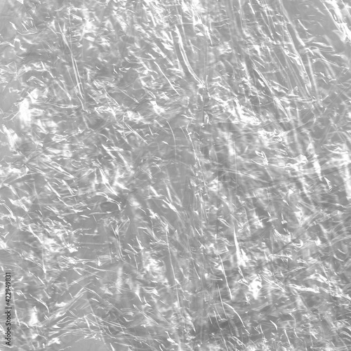 Crumpled transparent plastic backdrop. Trash texture