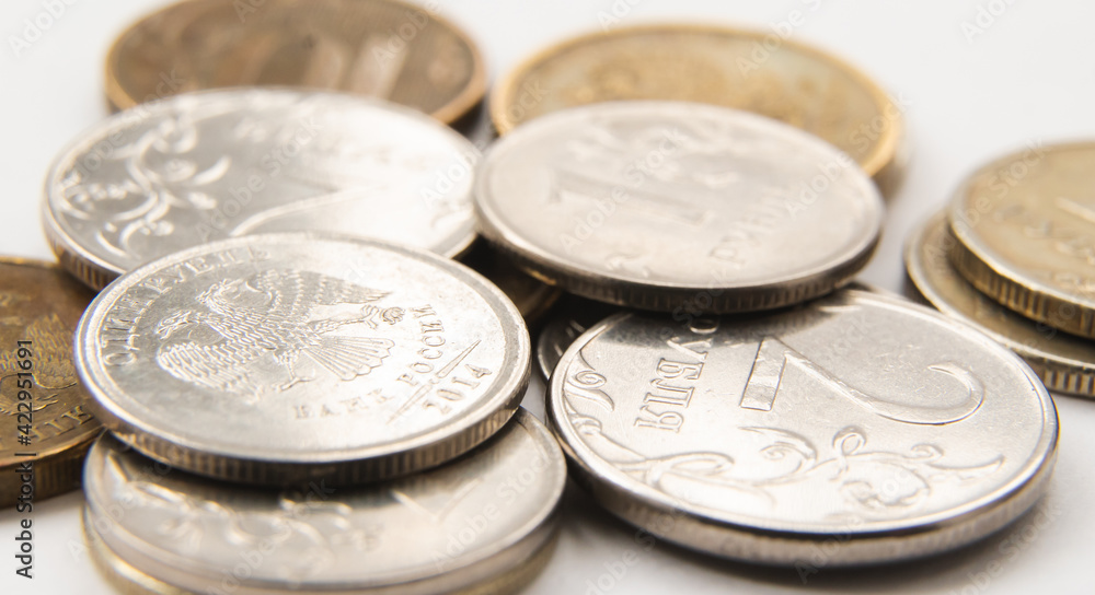 metal, round gray and gold coins in close-up. russian ruble metal, round gray and gold coins in close-up. russian ruble