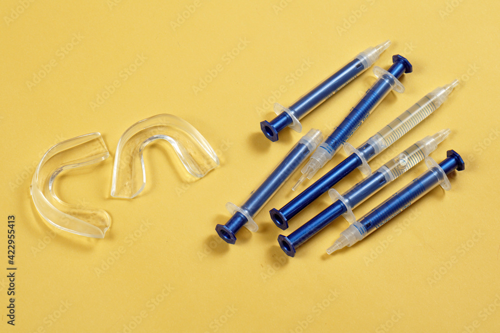 Teeth whitening kit on yellow Teeth whitening kit on yellow