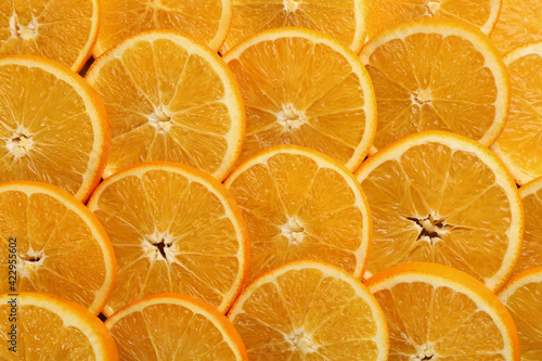 Slices of delicious oranges as background  closeup