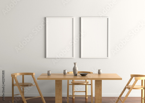 Two empty Indoor frame poster on the white wall inside the restaurant environment
