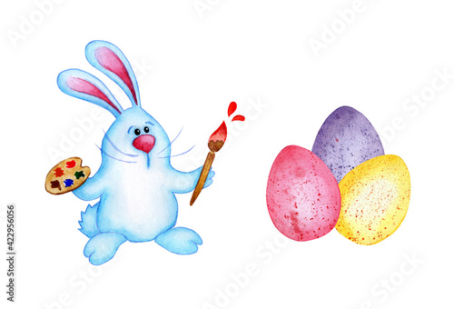 Watercolor illustration of a cute easter bunny with a palette brushing eggs for the holiday. The blue hare draws. Isolated on white background. Drawn by hand.