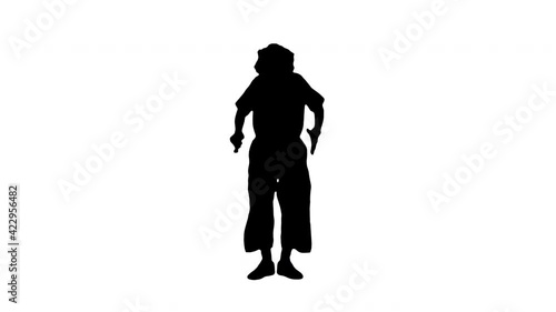 Silhouette Clown with red nose blowing party horn. photo