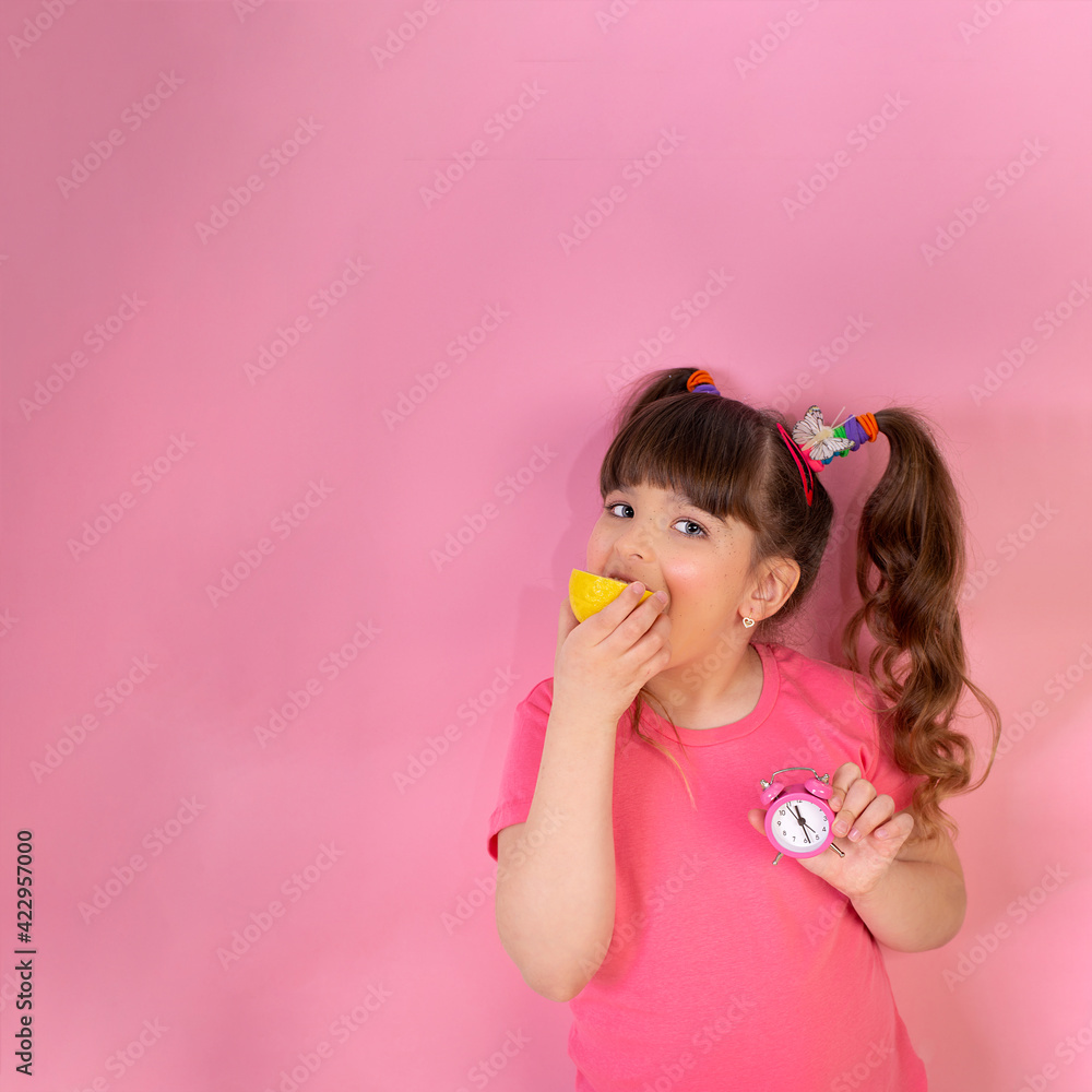 Funny little girl with fruit citrus fruit on pink background. Funny little girl with fruit citrus fruit on pink background.