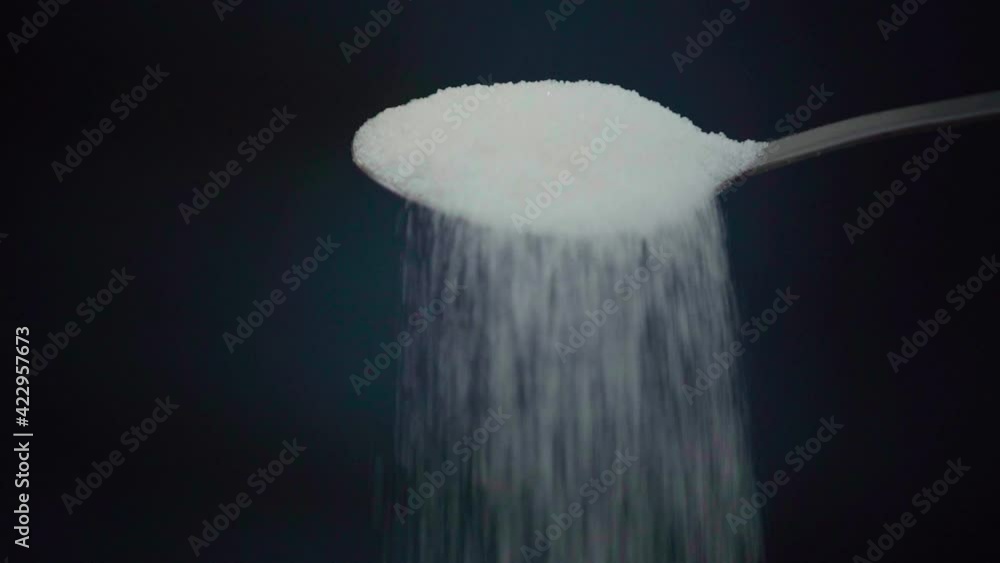 Close-up shot of a spoon with sugar Close-up shot of a spoon with sugar