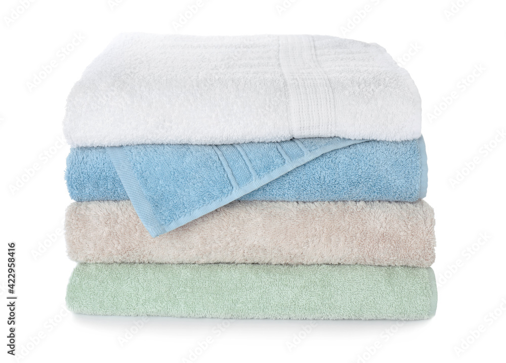Folded fresh clean towels on white background Folded fresh clean towels on white background