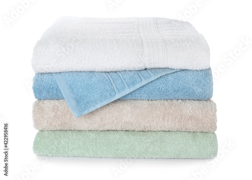 Folded fresh clean towels on white background