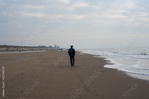man walking on the beach