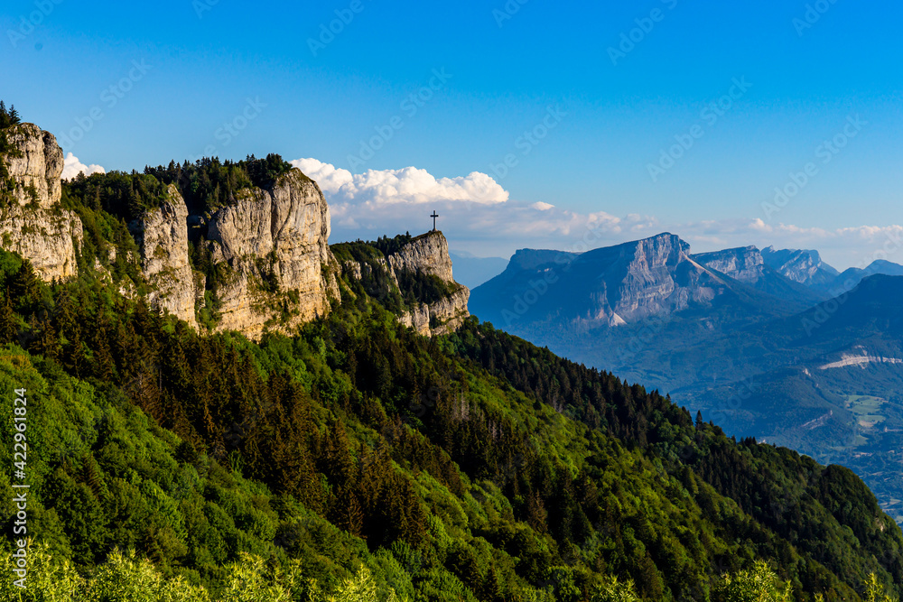 Summer beautiful mountain view. France, croix du Novolet. A big cross on top of the mountain.