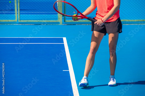 girls play tennis on a hard blue court © Павел Мещеряков