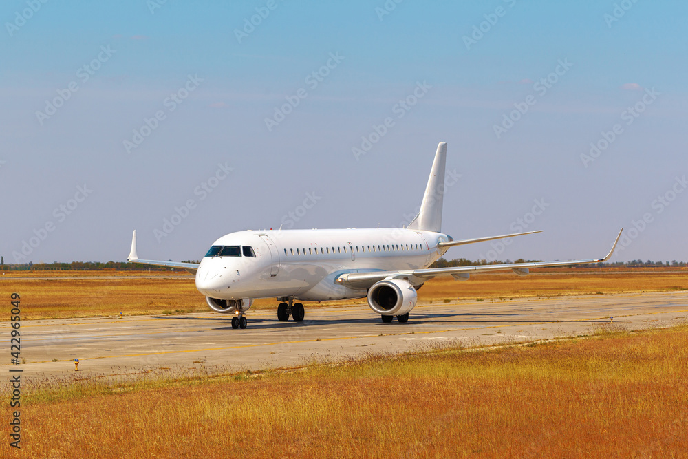 Big passenger airplane drives along the runway in airport Big passenger airplane drives along the runway in airport