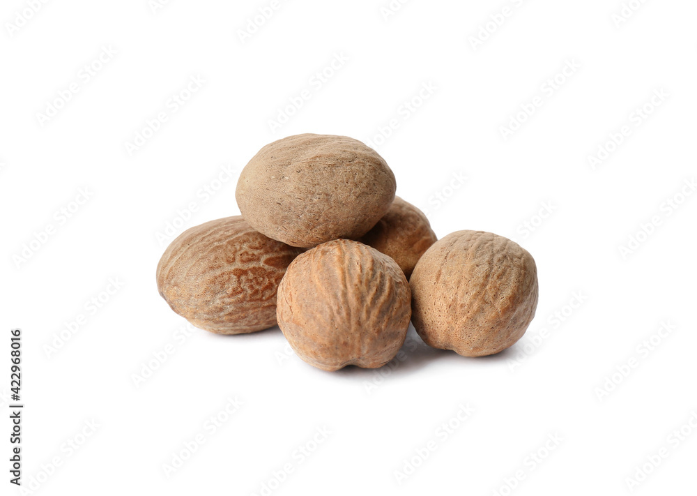 Heap of nutmeg seeds on white background Heap of nutmeg seeds on white background