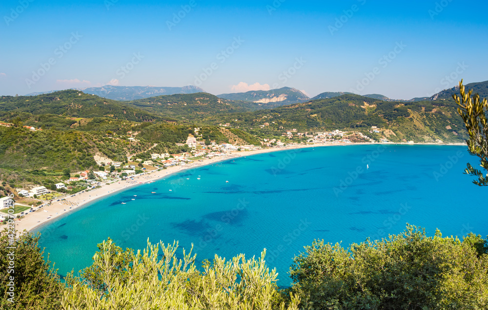 Naklejka premium Porto Timoni beach on Corfu island in Greece. Beautiful panoramic view of green mountains, clear sea water, secluded Pirates bay and double stony beach. Famous destination for summer vacation