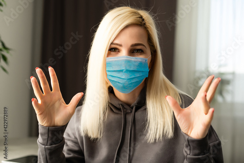 Coronavirus or Covid-19 concept. Business woman working from home wearing protective mask. Business woman in quarantine for coronavirus wearing protective mask. Working from home